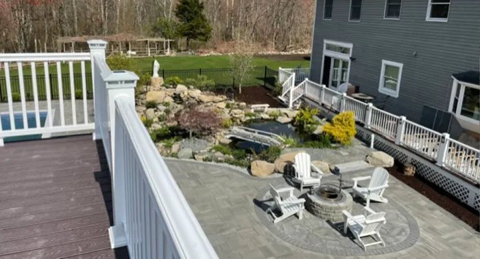 Aerial view of a backyard patio and firepit courtyard