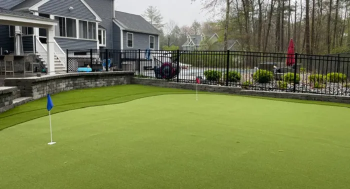 Putting green with patio and pergola