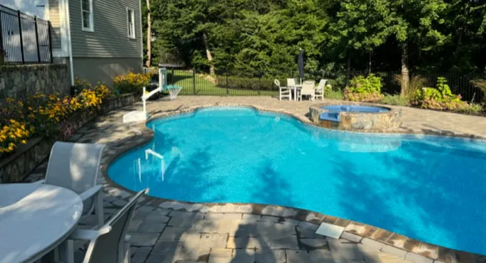 Inground pool with paver surround